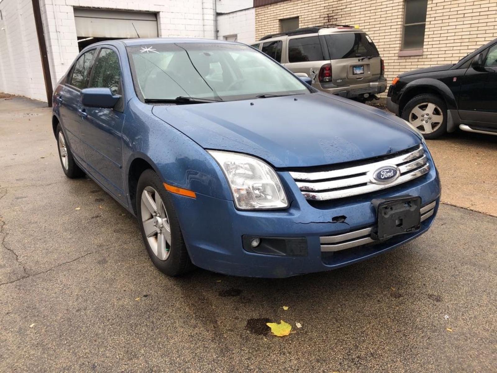 2009 BLUE FORD FUSION SE (3FAHP07129R) with an 3.0L engine, Automatic transmission, located at 151 Alpine Road, Rockford, IL, 61108, (815) 398-5010, 42.212986, -89.029320 - Photo #1
