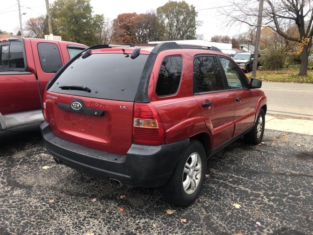 2005 RED KIA NEW SPORTAGE (KNDJE723257) with an 2.7L engine, Automatic transmission, located at 151 Alpine Road, Rockford, IL, 61108, (815) 398-5010, 42.212986, -89.029320 - Photo #2