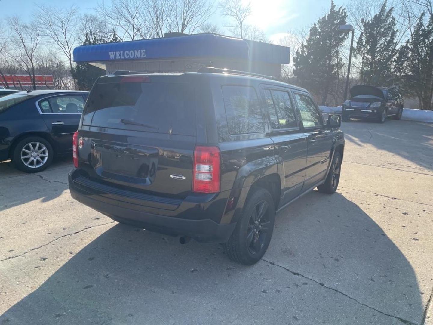 2014 BLACK JEEP PATRIOT SPORT (1C4NJPBAXED) with an 2.0L engine, Continuously Variable transmission, located at 1708 Broadway, Rockford, IL, 61104, (815) 397-5010, 42.252522, -89.069359 - Photo#2