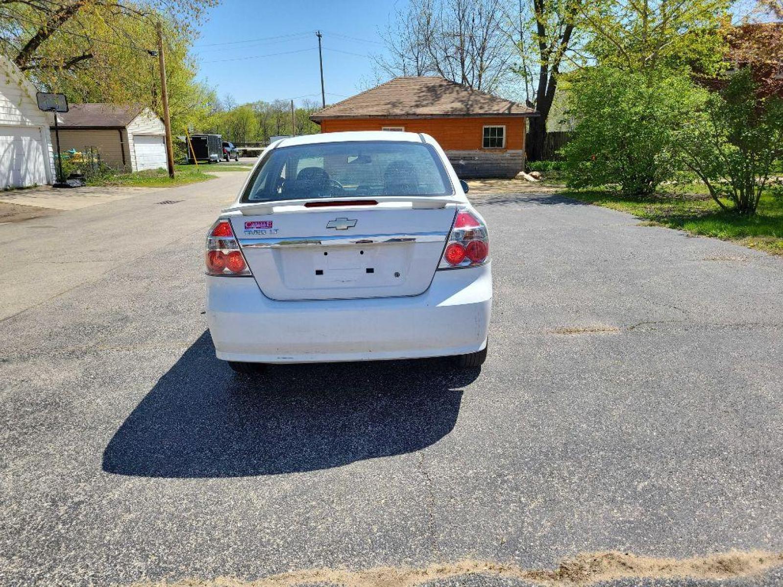 2009 WHITE CHEVROLET AVEO LT (KL1TG56E79B) with an 1.6L engine, Automatic transmission, located at 1708 Broadway, Rockford, IL, 61104, (815) 397-5010, 42.252522, -89.069359 - Photo #2
