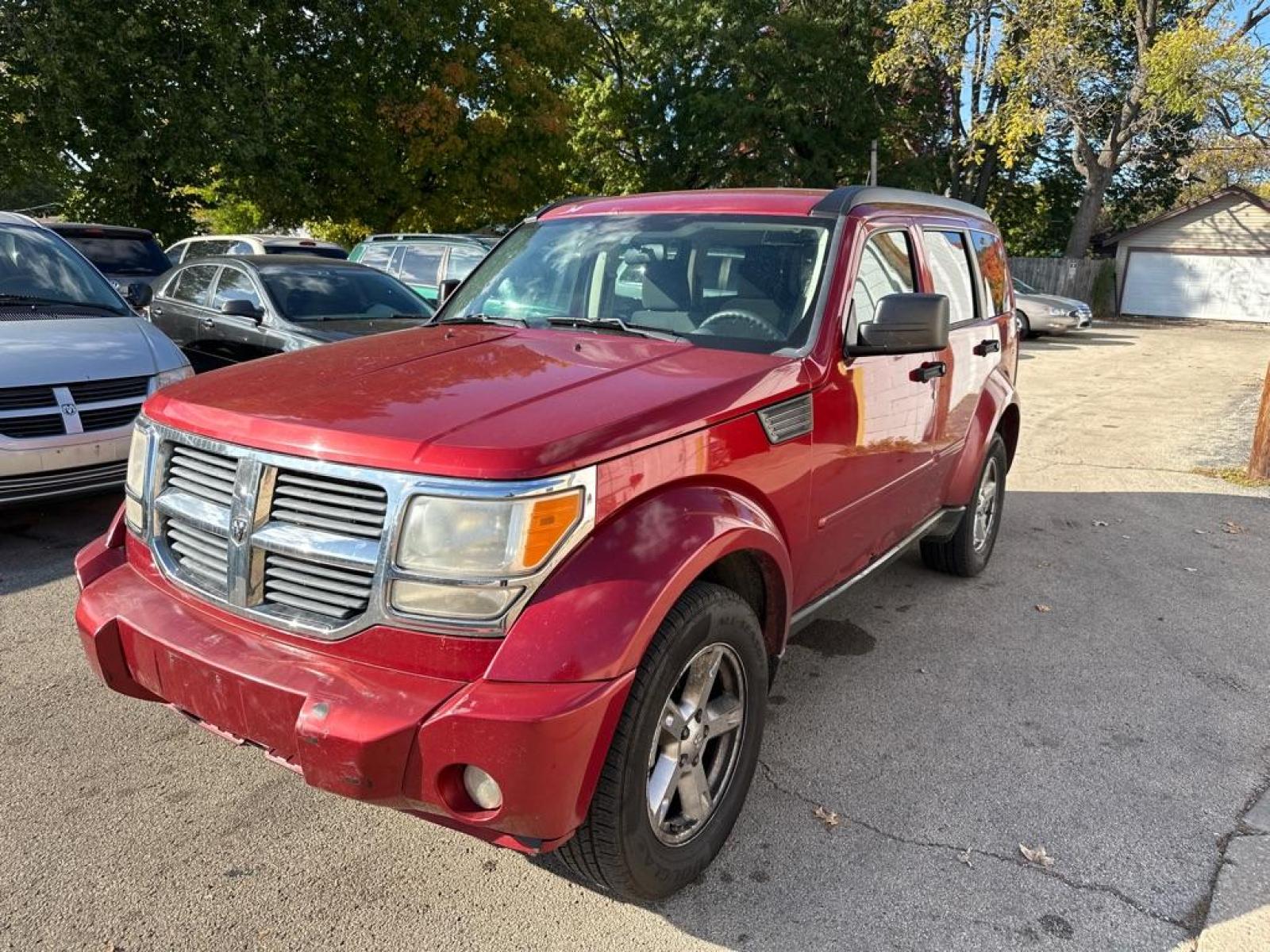 2007 RED DODGE NITRO SXT (1D8GU28K87W) with an 3.7L engine, Automatic transmission, located at 1708 Broadway, Rockford, IL, 61104, (815) 397-5010, 42.252522, -89.069359 - Photo #0