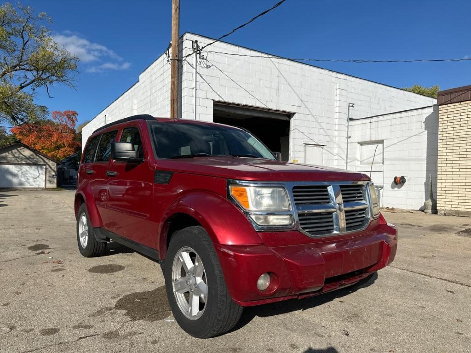 2007 RED DODGE NITRO SXT (1D8GU28K87W) with an 3.7L engine, Automatic transmission, located at 1708 Broadway, Rockford, IL, 61104, (815) 397-5010, 42.252522, -89.069359 - Photo #3