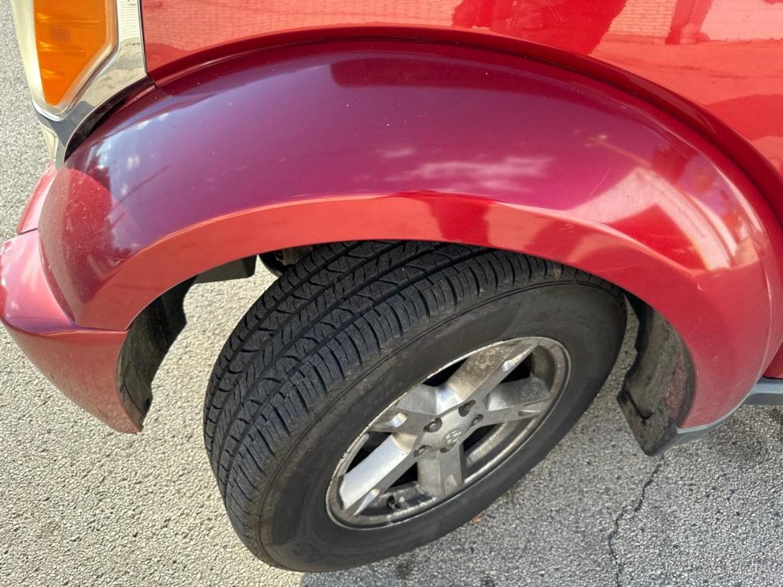 2007 RED DODGE NITRO SXT (1D8GU28K87W) with an 3.7L engine, Automatic transmission, located at 1708 Broadway, Rockford, IL, 61104, (815) 397-5010, 42.252522, -89.069359 - Photo #7