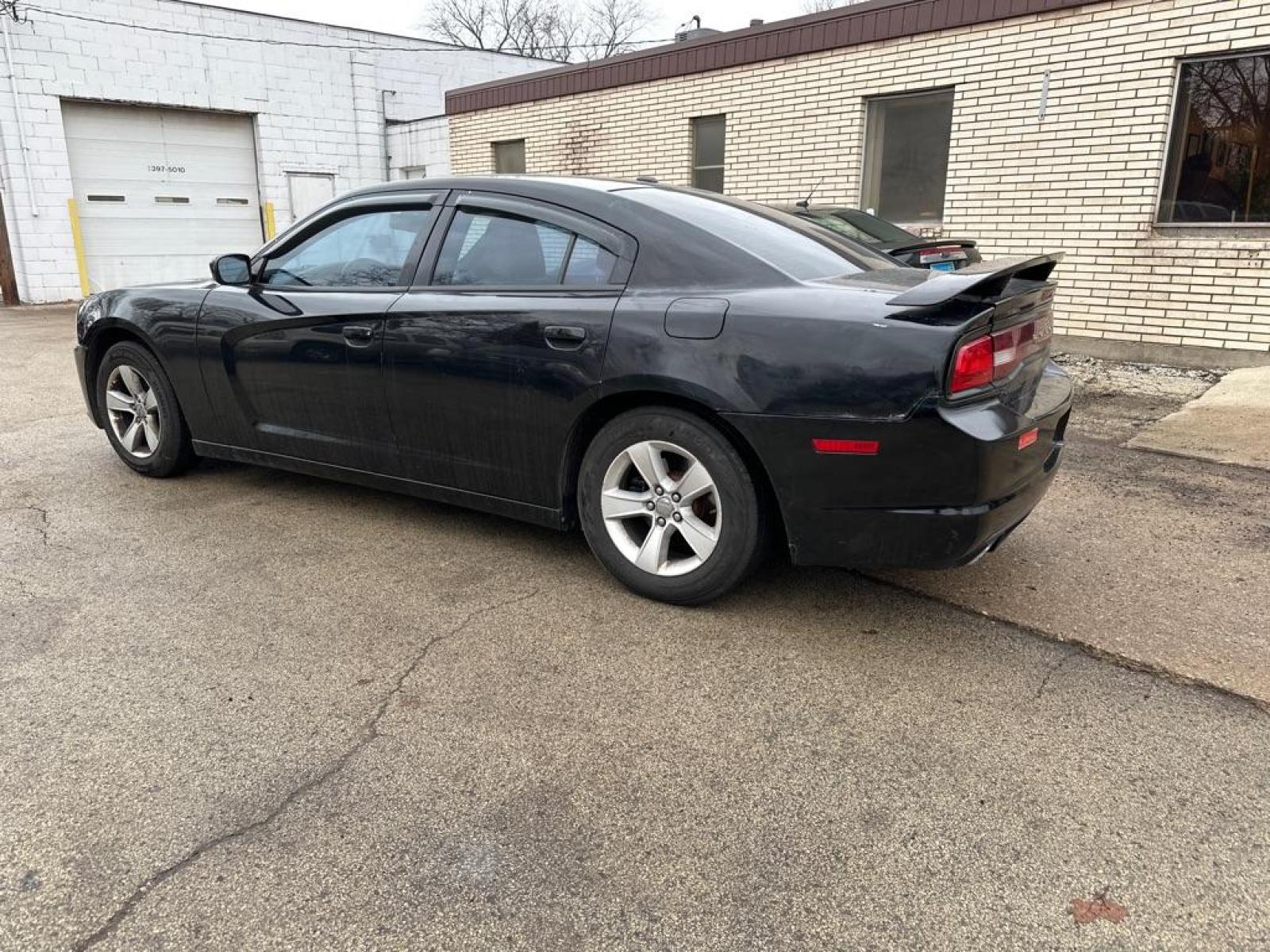 2012 BLACK DODGE CHARGER SE (2C3CDXBG5CH) with an 3.6L engine, Automatic transmission, located at 1708 Broadway, Rockford, IL, 61104, (815) 397-5010, 42.252522, -89.069359 - Photo #1