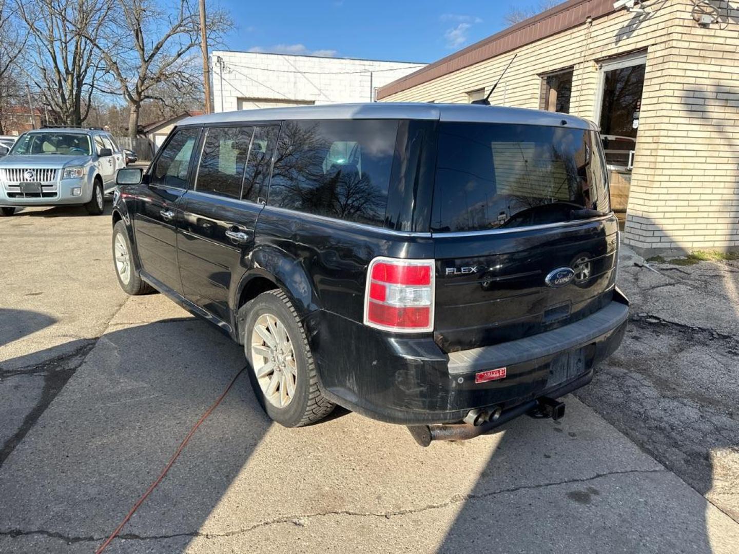 2009 BLACK FORD FLEX SEL (2FMDK52CX9B) with an 3.5L engine, Automatic transmission, located at 1708 Broadway, Rockford, IL, 61104, (815) 397-5010, 42.252522, -89.069359 - Photo#1
