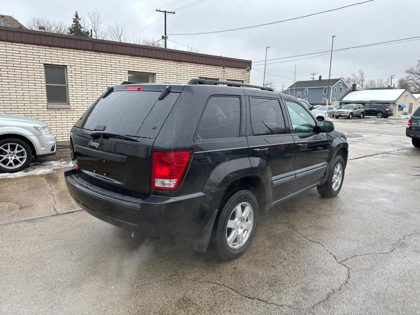 2009 BLACK JEEP GRAND CHEROKEE LAREDO (1J8GR48K79C) with an 3.7L engine, Automatic transmission, located at 1708 Broadway, Rockford, IL, 61104, (815) 397-5010, 42.252522, -89.069359 - Photo#2