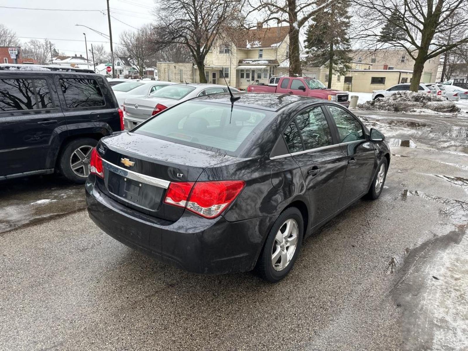 2012 BLACK CHEVROLET CRUZE LT (1G1PF5SC1C7) with an 1.4L engine, Automatic transmission, located at 1708 Broadway, Rockford, IL, 61104, (815) 397-5010, 42.252522, -89.069359 - Photo #3