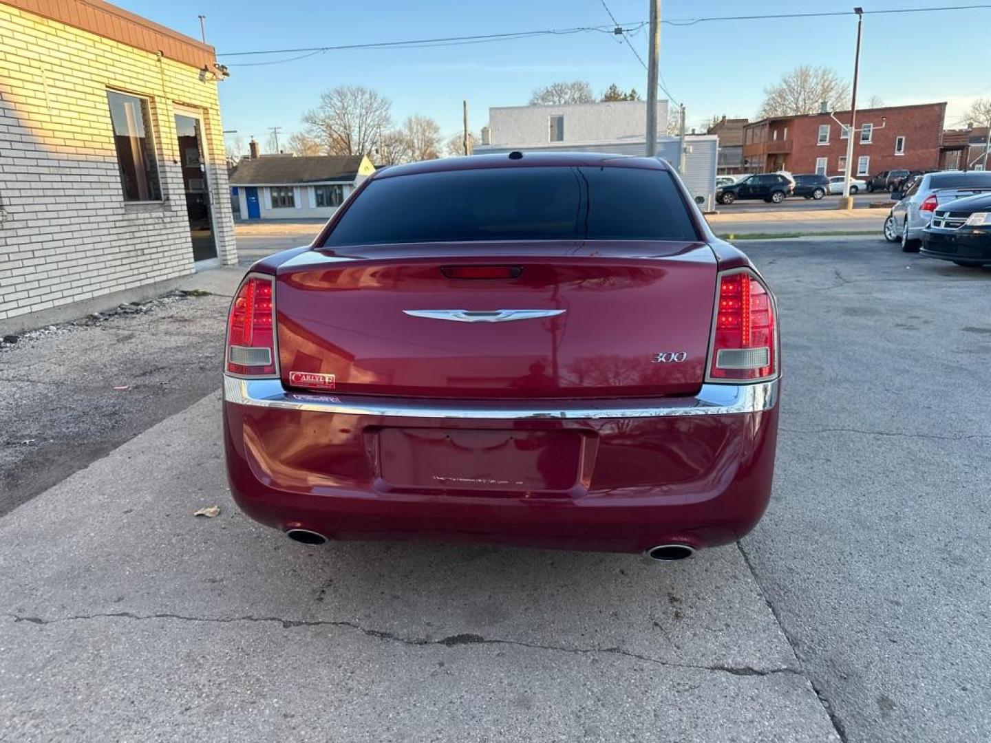 2013 RED CHRYSLER 300 (2C3CCAAG7DH) with an 3.6L engine, Automatic transmission, located at 1708 Broadway, Rockford, IL, 61104, (815) 397-5010, 42.252522, -89.069359 - Photo#2