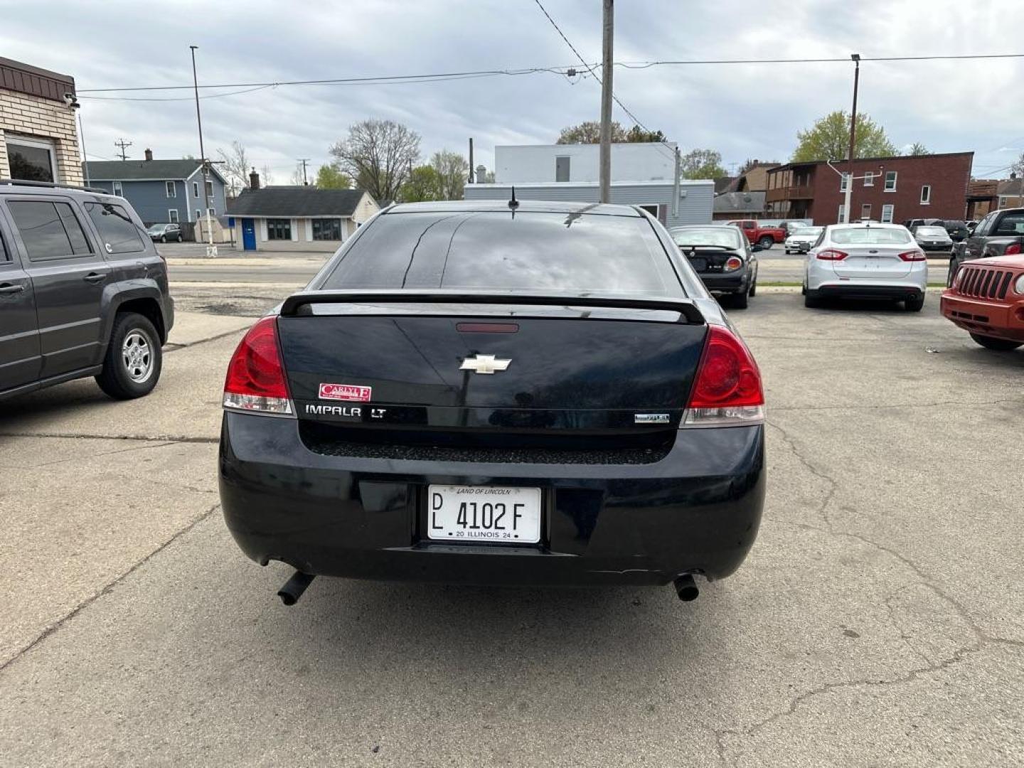 2012 BLACK CHEVROLET IMPALA LT (2G1WG5E3XC1) with an 3.6L engine, Automatic transmission, located at 1708 Broadway, Rockford, IL, 61104, (815) 397-5010, 42.252522, -89.069359 - Photo#2