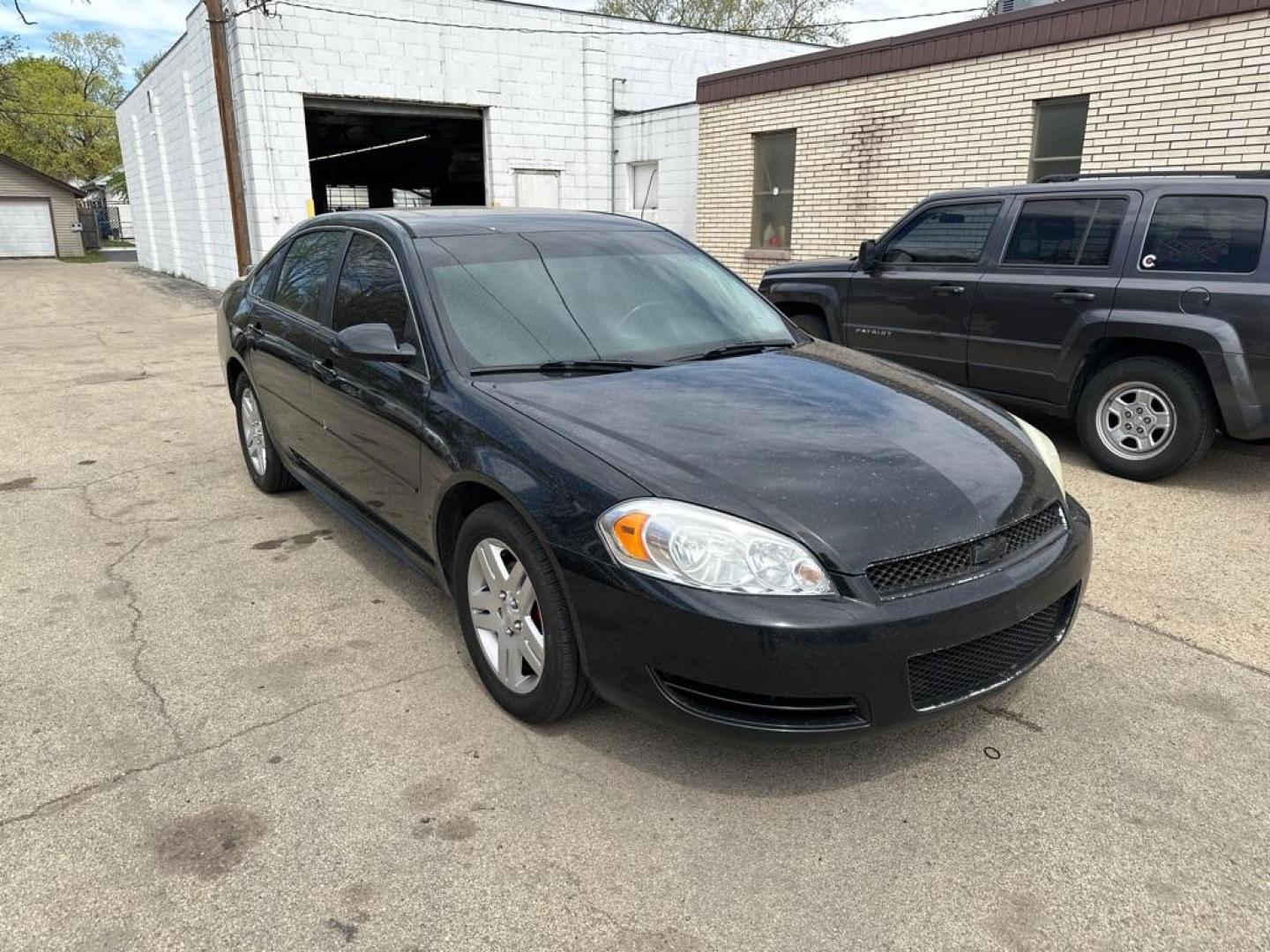 2012 BLACK CHEVROLET IMPALA LT (2G1WG5E3XC1) with an 3.6L engine, Automatic transmission, located at 1708 Broadway, Rockford, IL, 61104, (815) 397-5010, 42.252522, -89.069359 - Photo#4