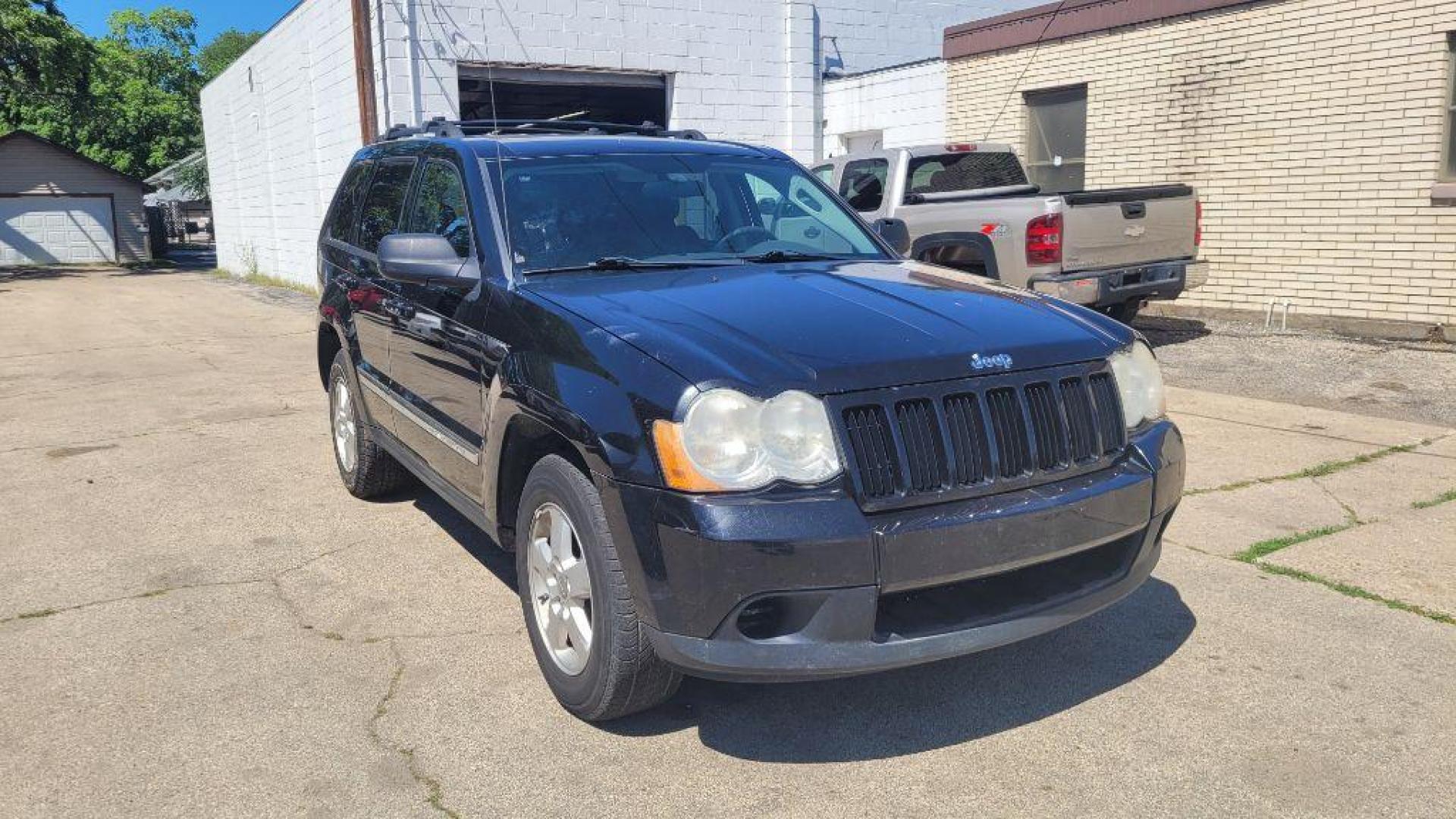 2010 BLACK JEEP GRAND CHEROKEE LAREDO (1J4PR4GKXAC) with an 3.7L engine, Automatic transmission, located at 1708 Broadway, Rockford, IL, 61104, (815) 397-5010, 42.252522, -89.069359 - Photo#1