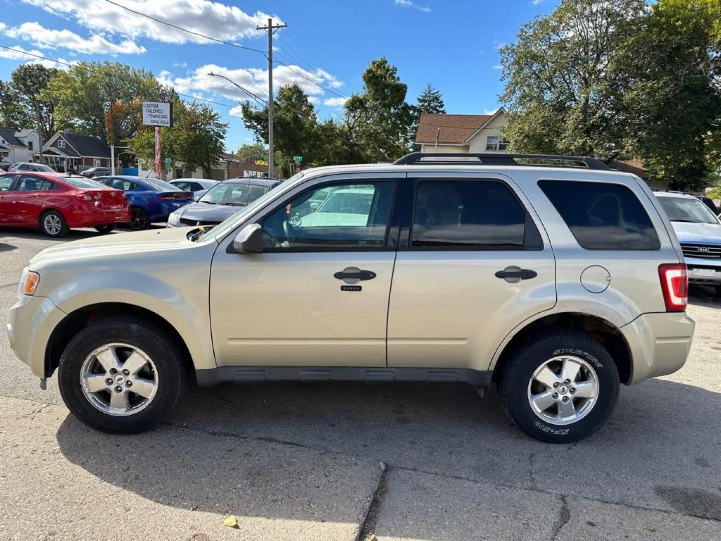2012 GOLD FORD ESCAPE XLT (1FMCU0DG7CK) with an 3.0L engine, Automatic transmission, located at 1708 Broadway, Rockford, IL, 61104, (815) 397-5010, 42.252522, -89.069359- Photo#6