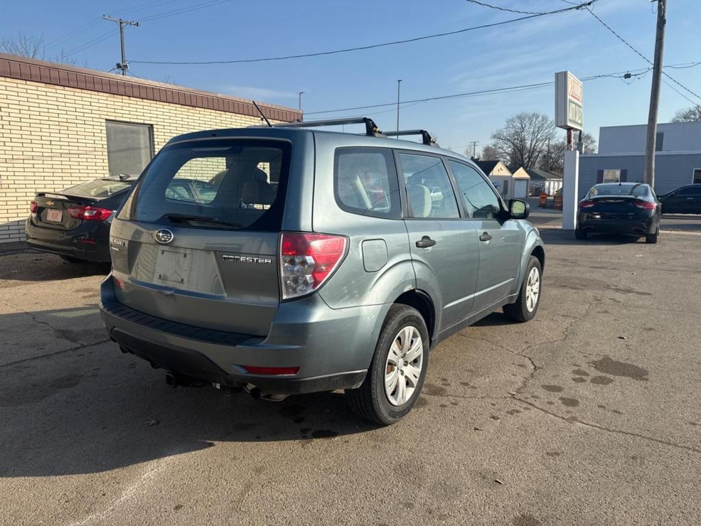 2010 GREEN SUBARU FORESTER 2.5X (JF2SH6AC4AH) with an 2.5L engine, Automatic transmission, located at 1708 Broadway, Rockford, IL, 61104, (815) 397-5010, 42.252522, -89.069359 - Photo#2