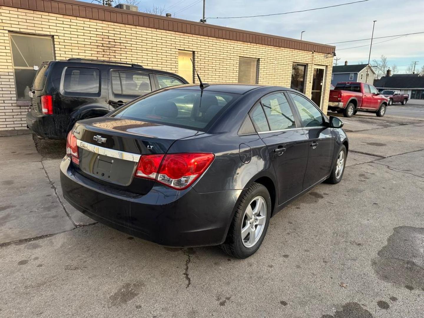 2014 BLUE CHEVROLET CRUZE LT (1G1PC5SB4E7) with an 1.4L engine, Automatic transmission, located at 1708 Broadway, Rockford, IL, 61104, (815) 397-5010, 42.252522, -89.069359 - Photo#2