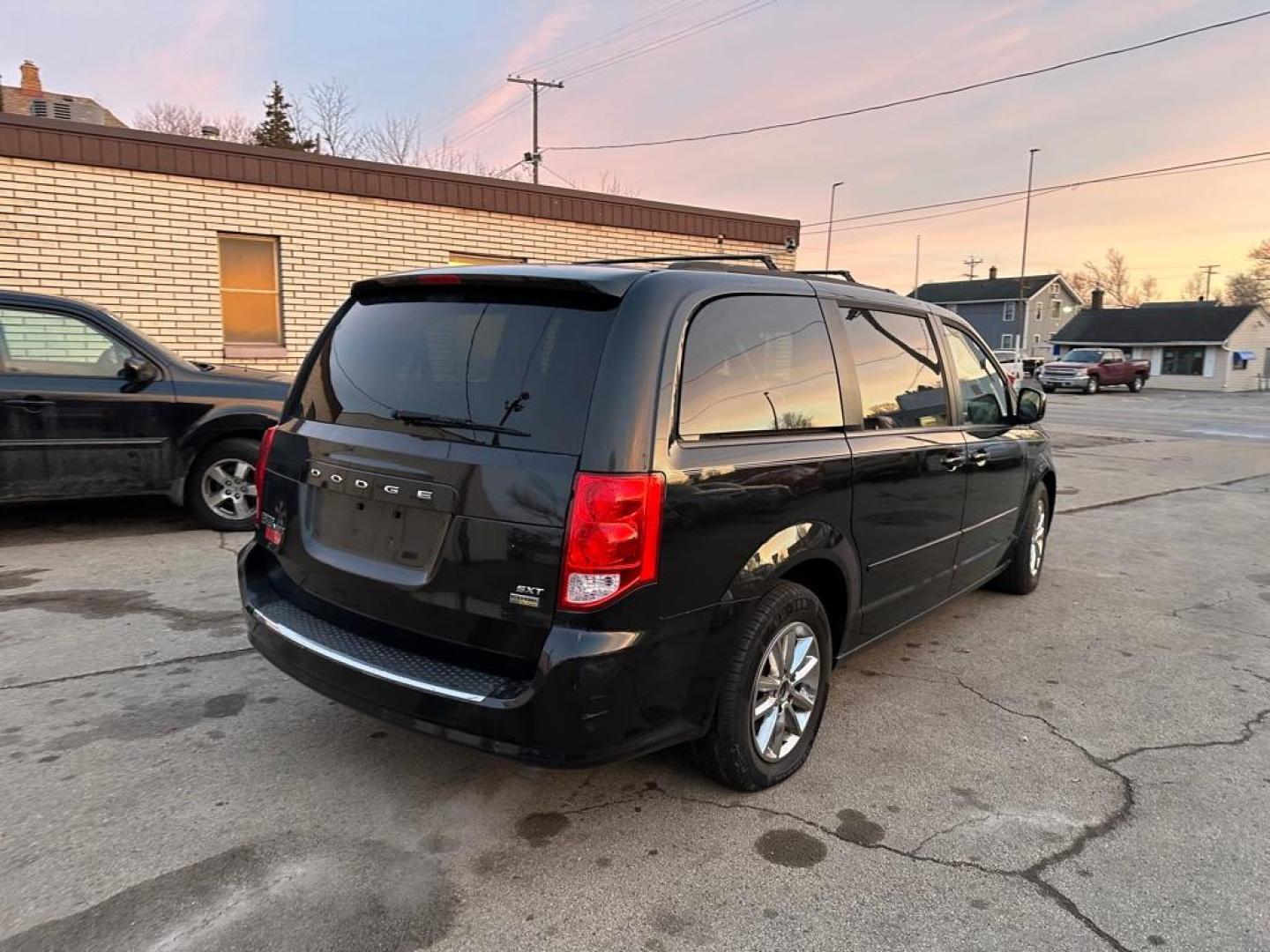 2015 BLACK DODGE GRAND CARAVAN SXT (2C4RDGCGXFR) with an 3.6L engine, Automatic transmission, located at 1708 Broadway, Rockford, IL, 61104, (815) 397-5010, 42.252522, -89.069359 - Photo#2