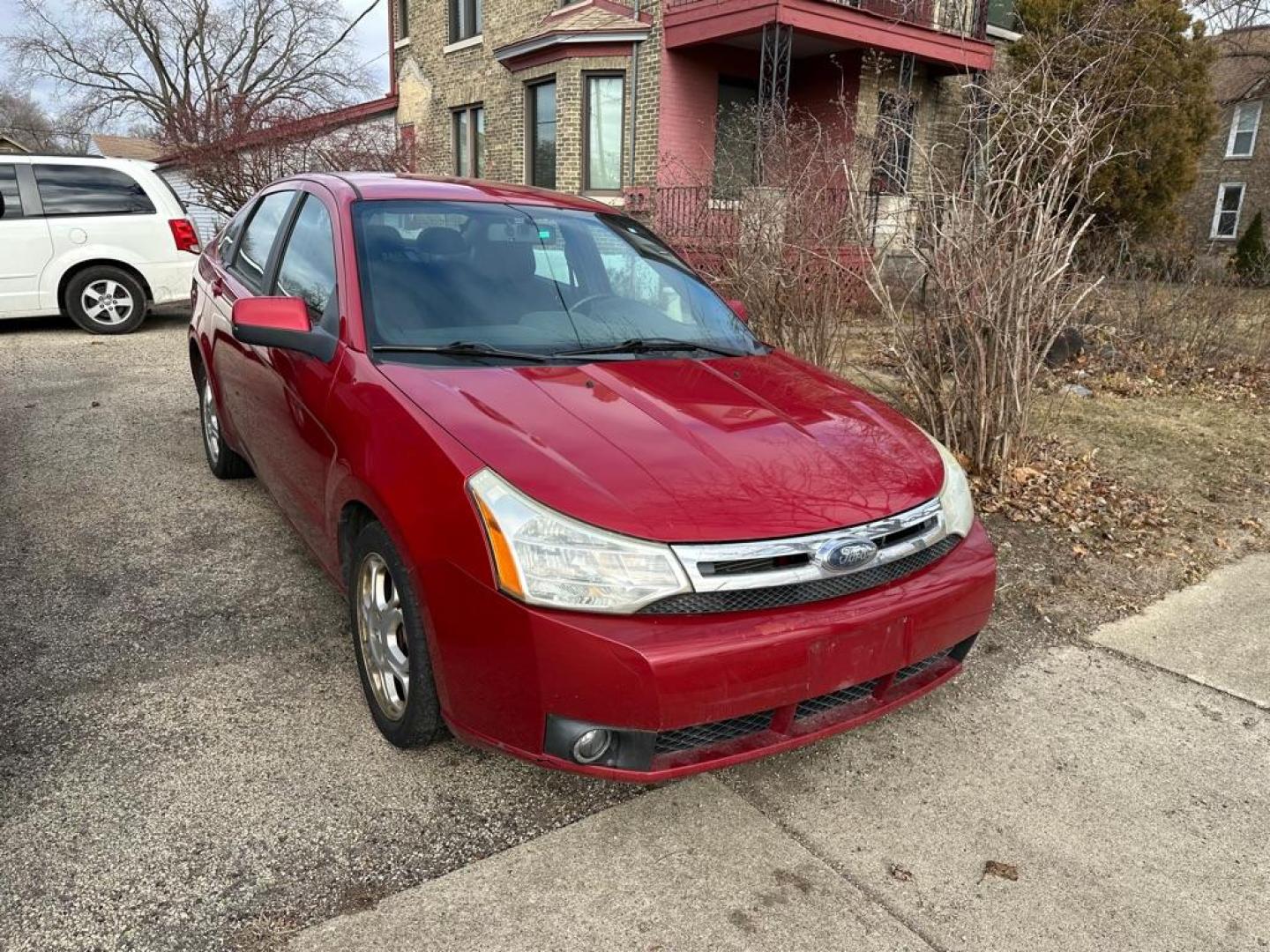 2009 RED FORD FOCUS SES (1FAHP36N59W) with an 2.0L engine, Automatic transmission, located at 1708 Broadway, Rockford, IL, 61104, (815) 397-5010, 42.252522, -89.069359 - Photo#0