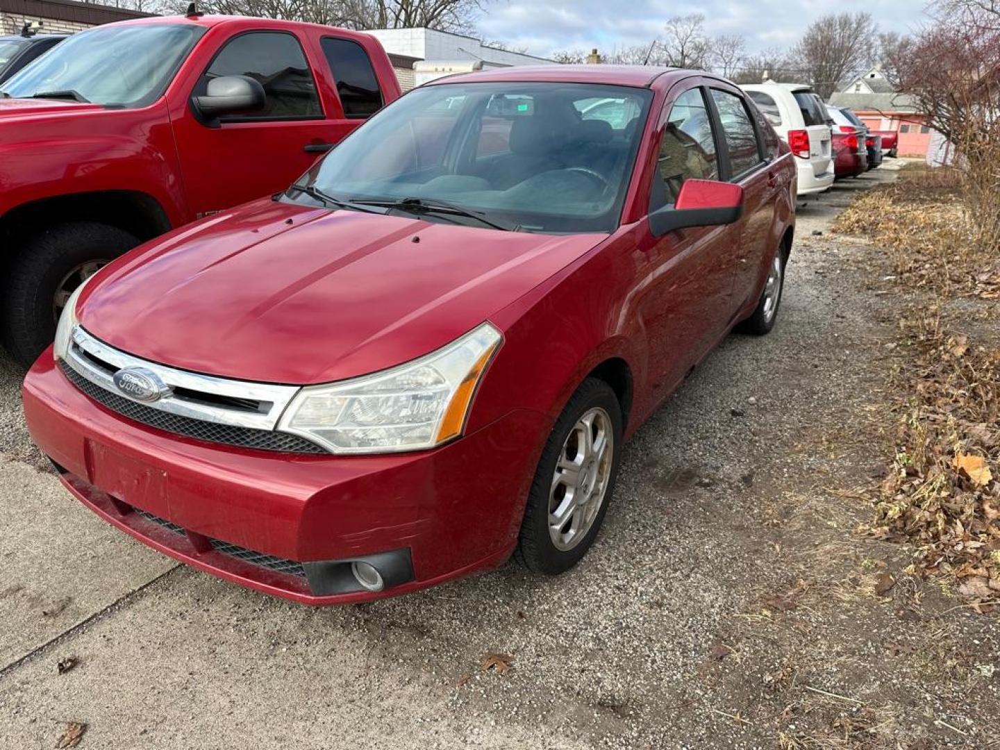 2009 RED FORD FOCUS SES (1FAHP36N59W) with an 2.0L engine, Automatic transmission, located at 1708 Broadway, Rockford, IL, 61104, (815) 397-5010, 42.252522, -89.069359 - Photo#1