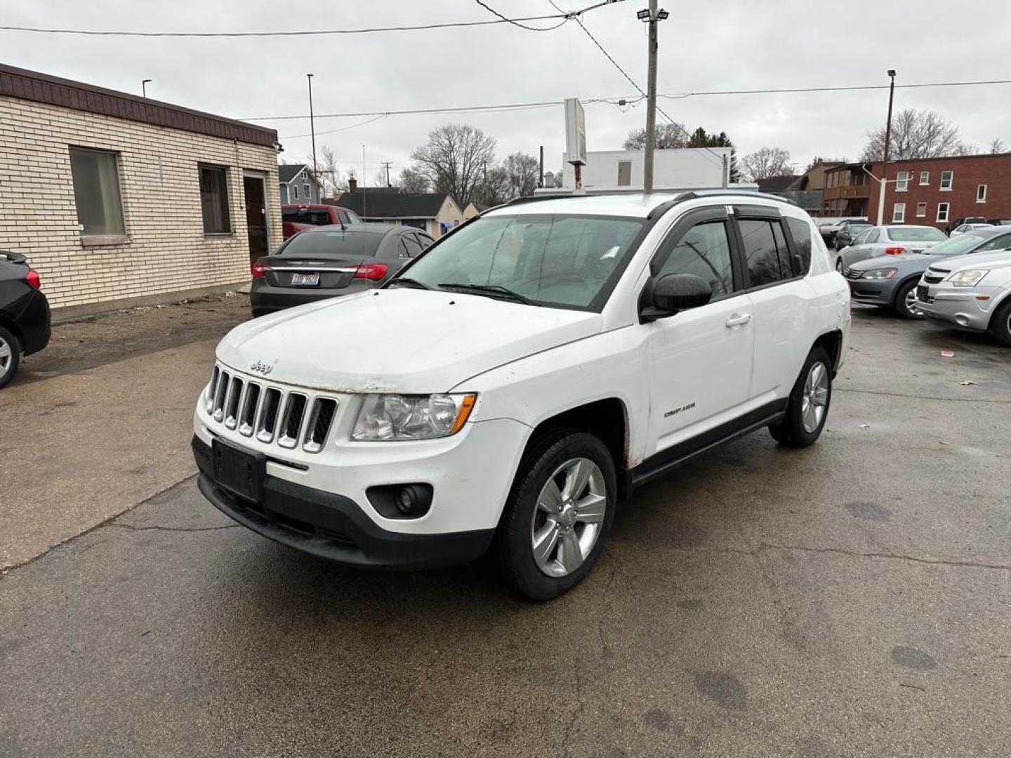 2012 WHITE JEEP COMPASS (1C4NJDAB6CD) with an 2.4L engine, Continuously Variable transmission, located at 1708 Broadway, Rockford, IL, 61104, (815) 397-5010, 42.252522, -89.069359 - Photo#0
