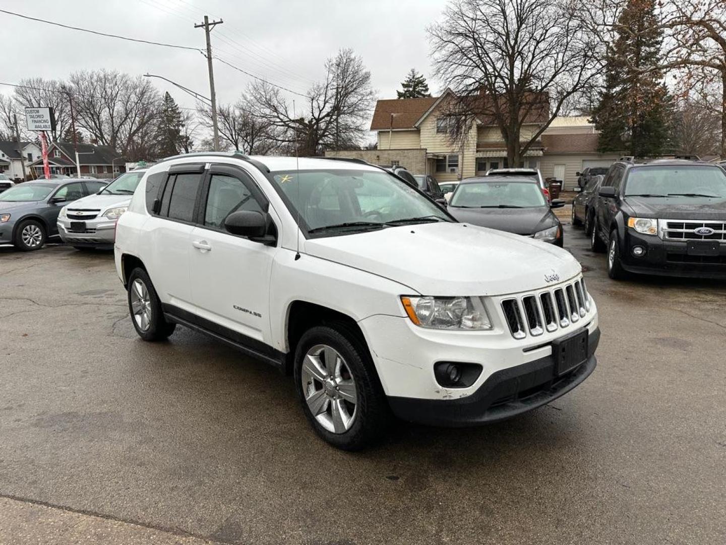 2012 WHITE JEEP COMPASS (1C4NJDAB6CD) with an 2.4L engine, Continuously Variable transmission, located at 1708 Broadway, Rockford, IL, 61104, (815) 397-5010, 42.252522, -89.069359 - Photo#1