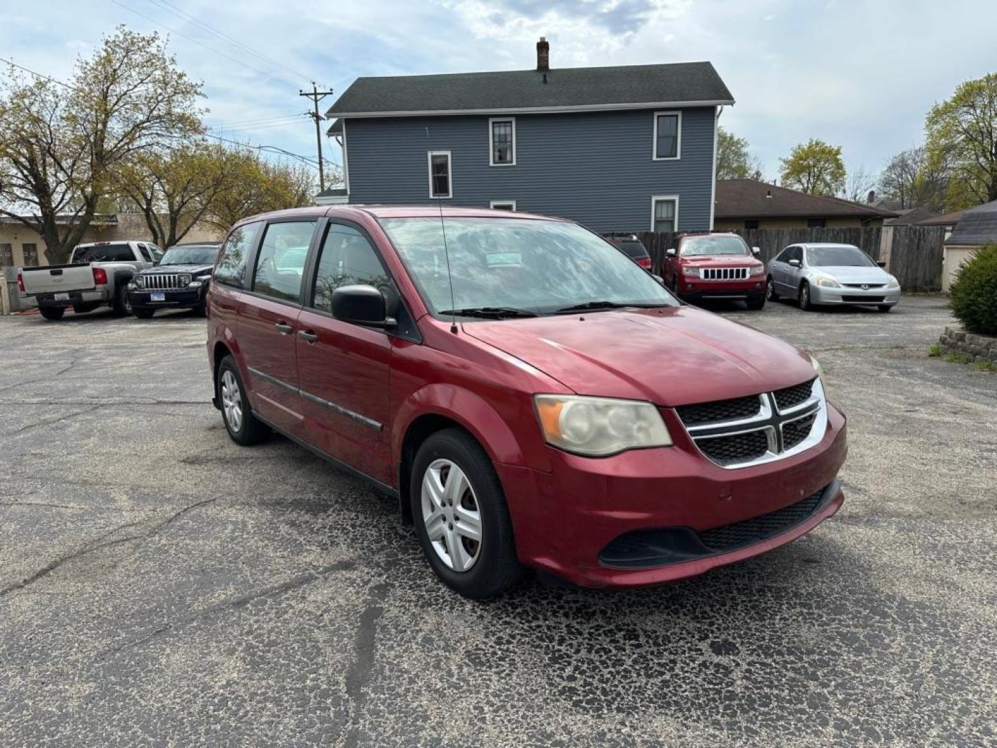 2014 RED DODGE GRAND CARAVAN SE (2C4RDGBG7ER) with an 3.6L engine, Automatic transmission, located at 1708 Broadway, Rockford, IL, 61104, (815) 397-5010, 42.252522, -89.069359 - Photo#1
