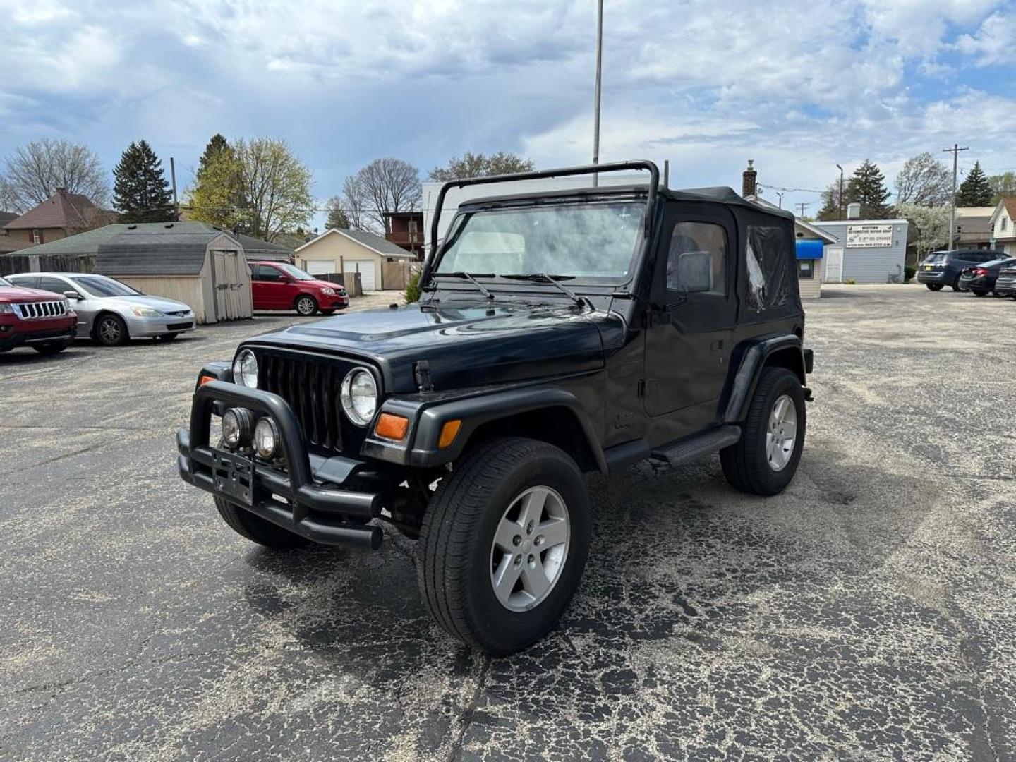 1997 BLACK JEEP WRANGLER / TJ SE (1J4FY29P8VP) with an 2.5L engine, Automatic transmission, located at 1708 Broadway, Rockford, IL, 61104, (815) 397-5010, 42.252522, -89.069359 - Photo#0