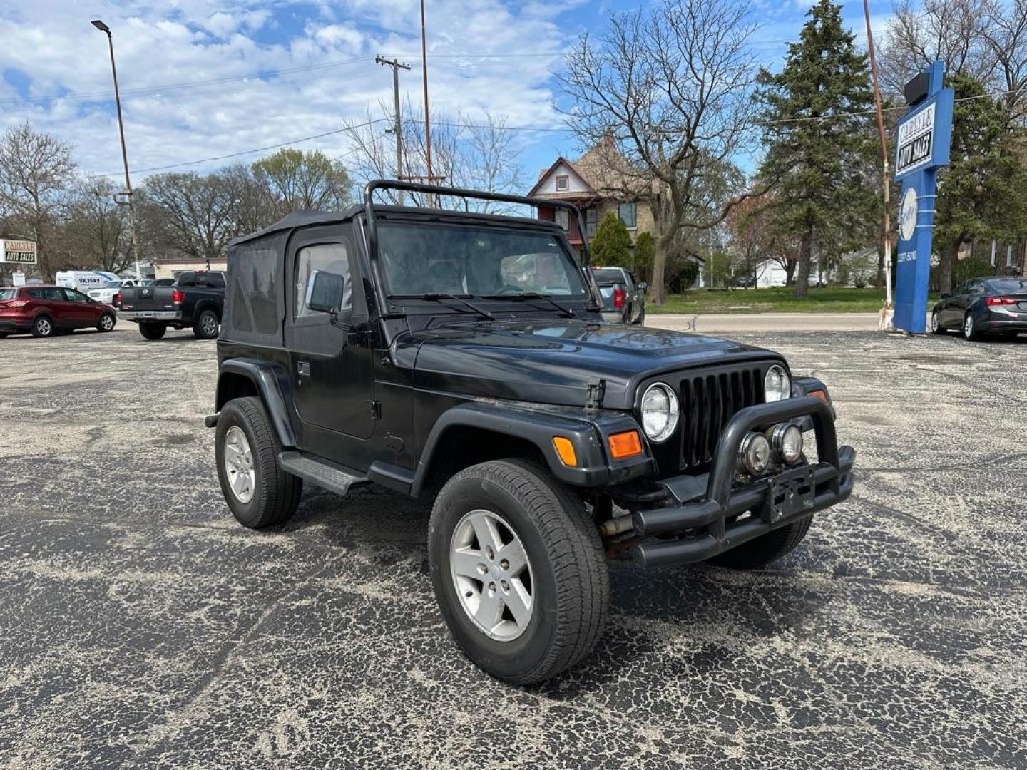 1997 BLACK JEEP WRANGLER / TJ SE (1J4FY29P8VP) with an 2.5L engine, Automatic transmission, located at 1708 Broadway, Rockford, IL, 61104, (815) 397-5010, 42.252522, -89.069359 - Photo#1