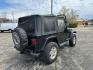 1997 BLACK JEEP WRANGLER / TJ SE (1J4FY29P8VP) with an 2.5L engine, Automatic transmission, located at 1708 Broadway, Rockford, IL, 61104, (815) 397-5010, 42.252522, -89.069359 - Photo#2