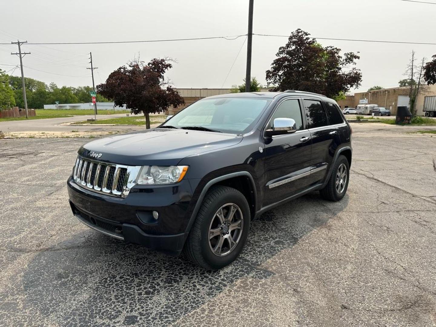 2011 BLUE JEEP GRAND CHEROKEE OVERLAND (1J4RR6GT9BC) with an 5.7L engine, Automatic transmission, located at 1708 Broadway, Rockford, IL, 61104, (815) 397-5010, 42.252522, -89.069359 - Photo#0