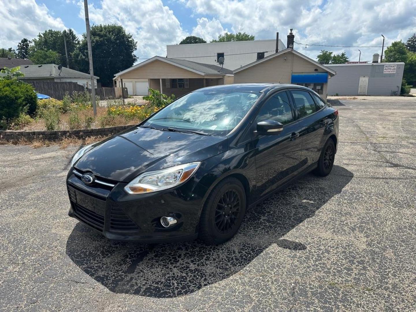 2012 BLACK FORD FOCUS SE (1FAHP3F2XCL) with an 2.0L engine, Automatic transmission, located at 1708 Broadway, Rockford, IL, 61104, (815) 397-5010, 42.252522, -89.069359 - Photo#0