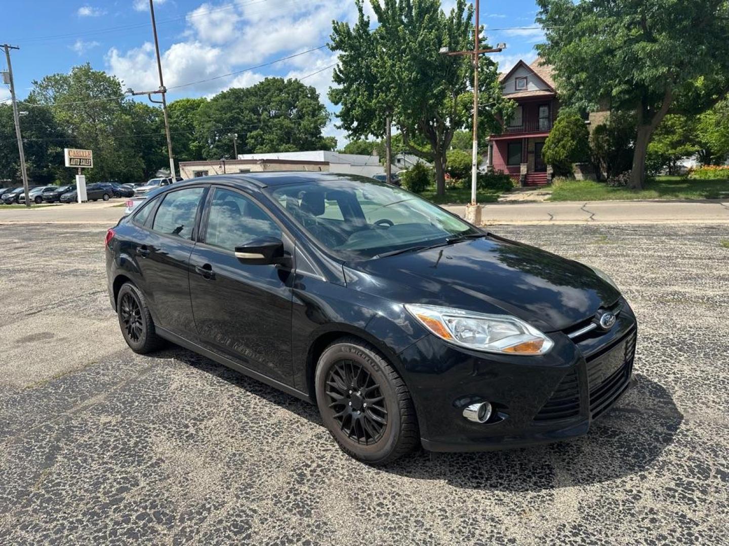 2012 BLACK FORD FOCUS SE (1FAHP3F2XCL) with an 2.0L engine, Automatic transmission, located at 1708 Broadway, Rockford, IL, 61104, (815) 397-5010, 42.252522, -89.069359 - Photo#1