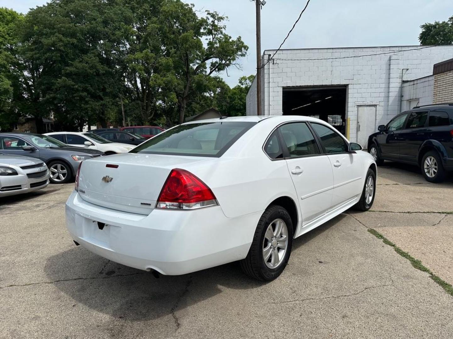2014 WHITE CHEVROLET IMPALA LIMITED LS (2G1WA5E37E1) with an 3.6L engine, Automatic transmission, located at 1708 Broadway, Rockford, IL, 61104, (815) 397-5010, 42.252522, -89.069359 - Photo#3