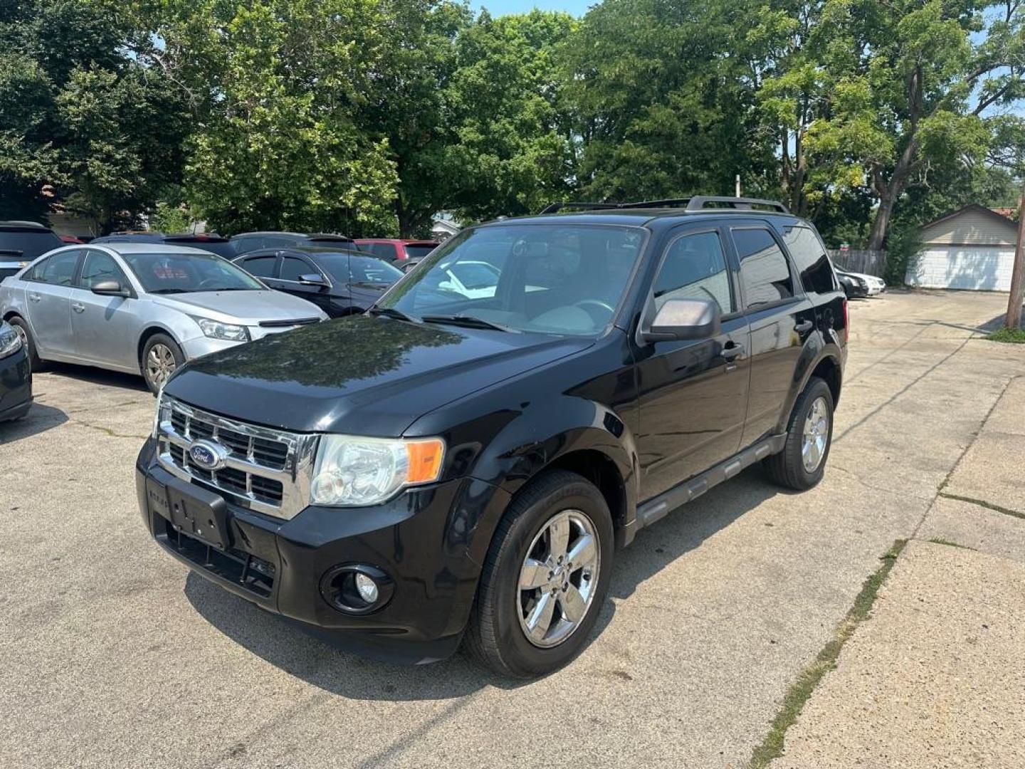 2010 BLACK FORD ESCAPE XLT (1FMCU0DG3AK) with an 3.0L engine, Automatic transmission, located at 1708 Broadway, Rockford, IL, 61104, (815) 397-5010, 42.252522, -89.069359 - Photo#0