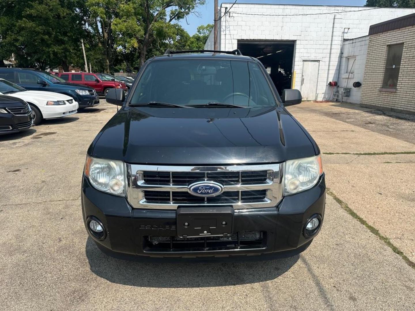 2010 BLACK FORD ESCAPE XLT (1FMCU0DG3AK) with an 3.0L engine, Automatic transmission, located at 1708 Broadway, Rockford, IL, 61104, (815) 397-5010, 42.252522, -89.069359 - Photo#1