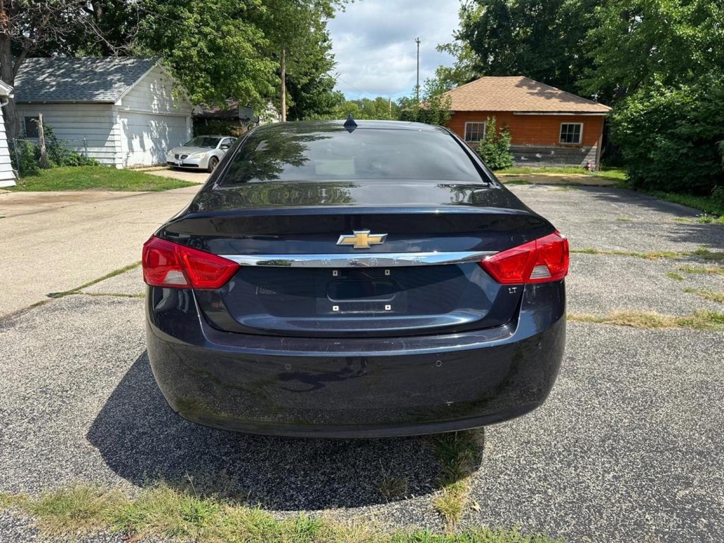 2014 BLUE CHEVROLET IMPALA LT (2G1125S38E9) with an 3.6L engine, Automatic transmission, located at 1708 Broadway, Rockford, IL, 61104, (815) 397-5010, 42.252522, -89.069359 - Photo#4