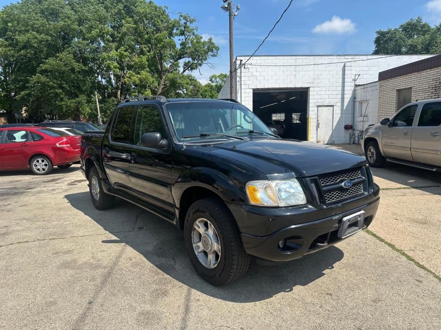 2004 BLACK FORD EXPLORER SPORT (1FMZU77KX4U) with an 4.0L engine, Automatic transmission, located at 1708 Broadway, Rockford, IL, 61104, (815) 397-5010, 42.252522, -89.069359 - Photo#1