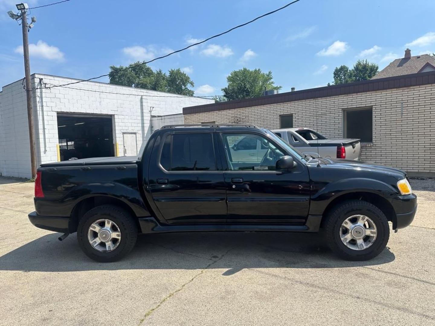 2004 BLACK FORD EXPLORER SPORT (1FMZU77KX4U) with an 4.0L engine, Automatic transmission, located at 1708 Broadway, Rockford, IL, 61104, (815) 397-5010, 42.252522, -89.069359 - Photo#2