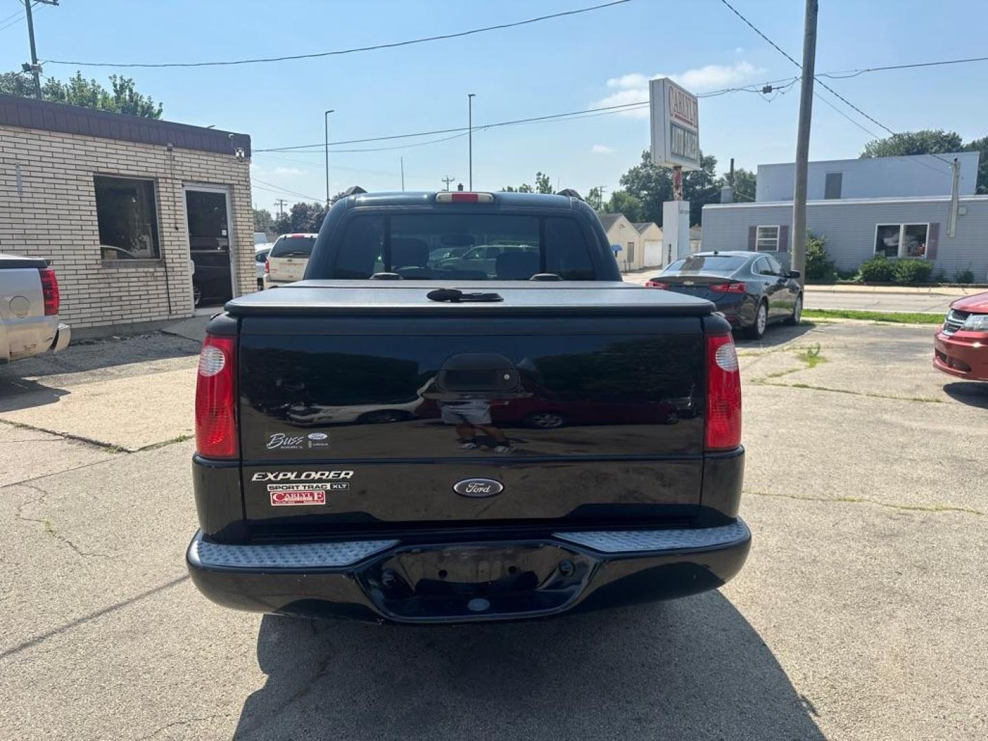 2004 BLACK FORD EXPLORER SPORT (1FMZU77KX4U) with an 4.0L engine, Automatic transmission, located at 1708 Broadway, Rockford, IL, 61104, (815) 397-5010, 42.252522, -89.069359 - Photo#4