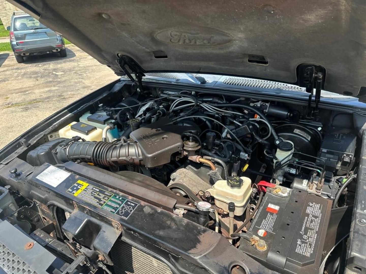 2004 BLACK FORD EXPLORER SPORT (1FMZU77KX4U) with an 4.0L engine, Automatic transmission, located at 1708 Broadway, Rockford, IL, 61104, (815) 397-5010, 42.252522, -89.069359 - Photo#16