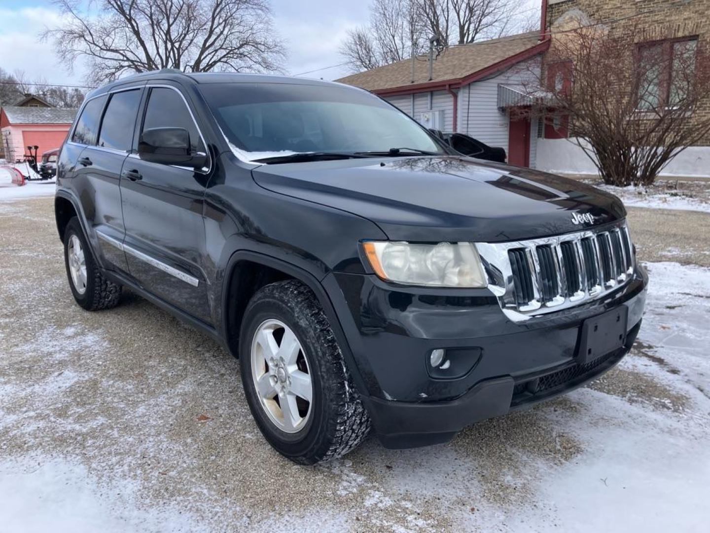 2012 BLACK JEEP GRAND CHEROKEE LAREDO (1C4RJFAG4CC) with an 3.6L engine, Automatic transmission, located at 1708 Broadway, Rockford, IL, 61104, (815) 397-5010, 42.252522, -89.069359 - Photo#1