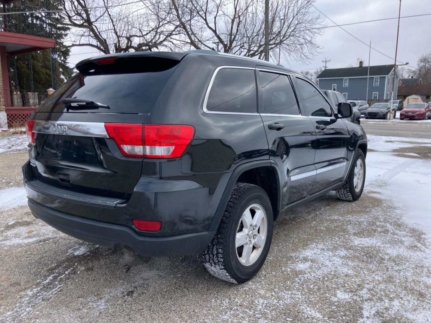 2012 BLACK JEEP GRAND CHEROKEE LAREDO (1C4RJFAG4CC) with an 3.6L engine, Automatic transmission, located at 1708 Broadway, Rockford, IL, 61104, (815) 397-5010, 42.252522, -89.069359 - Photo#2