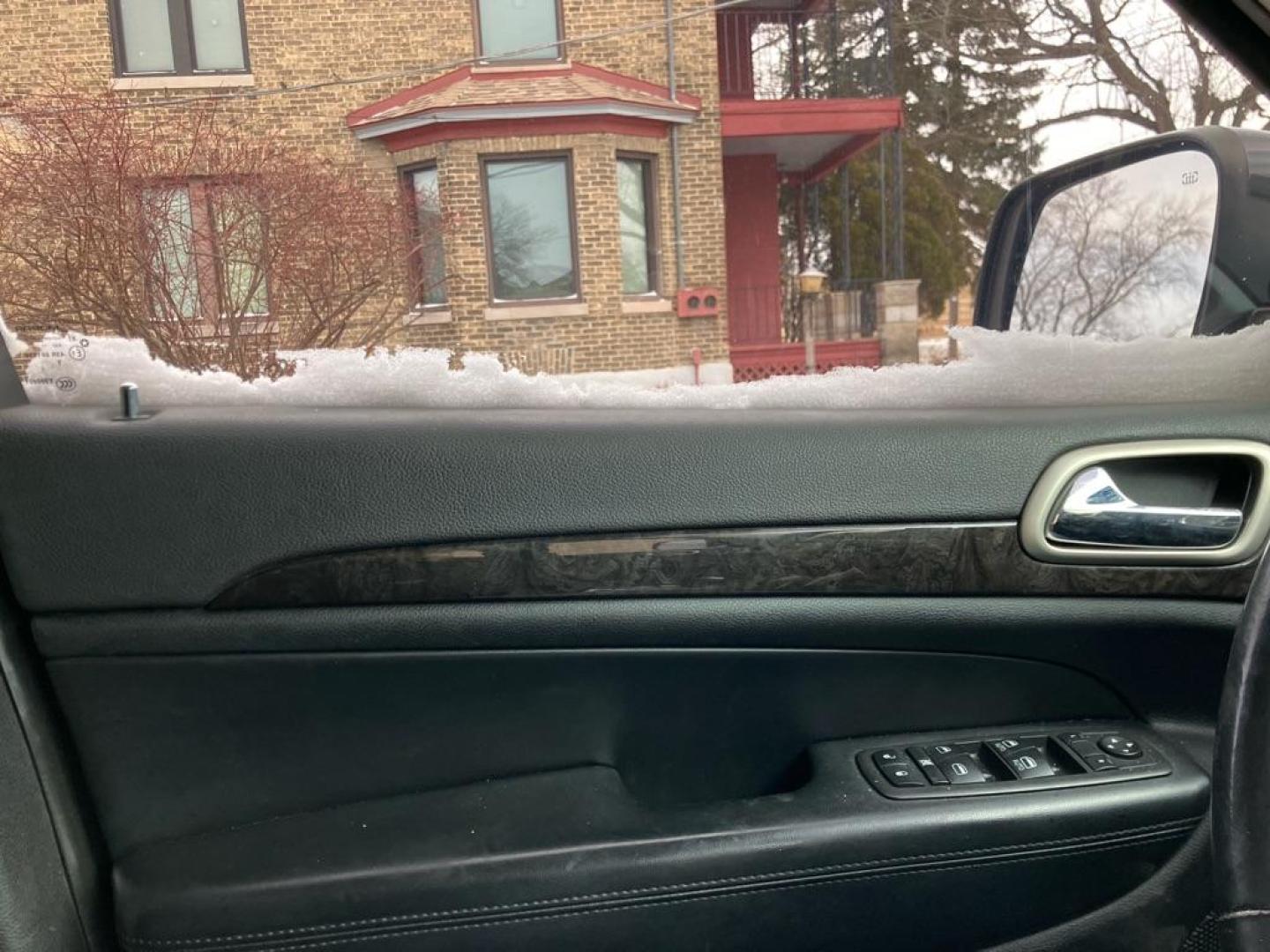 2012 BLACK JEEP GRAND CHEROKEE LAREDO (1C4RJFAG4CC) with an 3.6L engine, Automatic transmission, located at 1708 Broadway, Rockford, IL, 61104, (815) 397-5010, 42.252522, -89.069359 - Photo#6