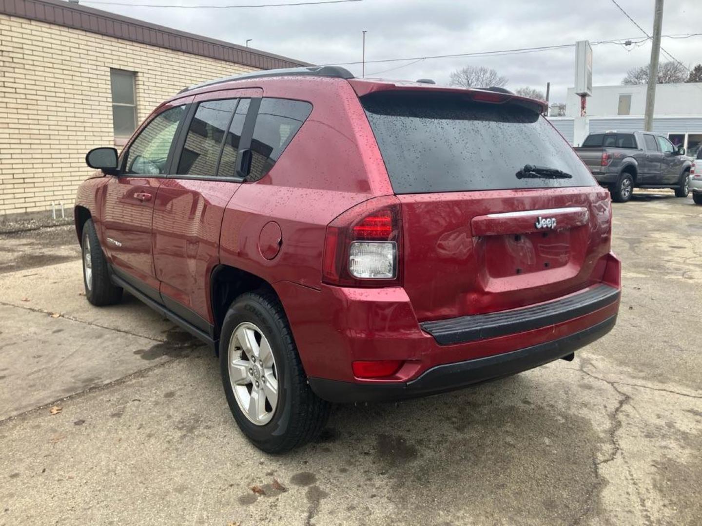 2016 RED JEEP COMPASS SPORT (1C4NJCBA9GD) with an 2.0L engine, Continuously Variable transmission, located at 1708 Broadway, Rockford, IL, 61104, (815) 397-5010, 42.252522, -89.069359 - Photo#3