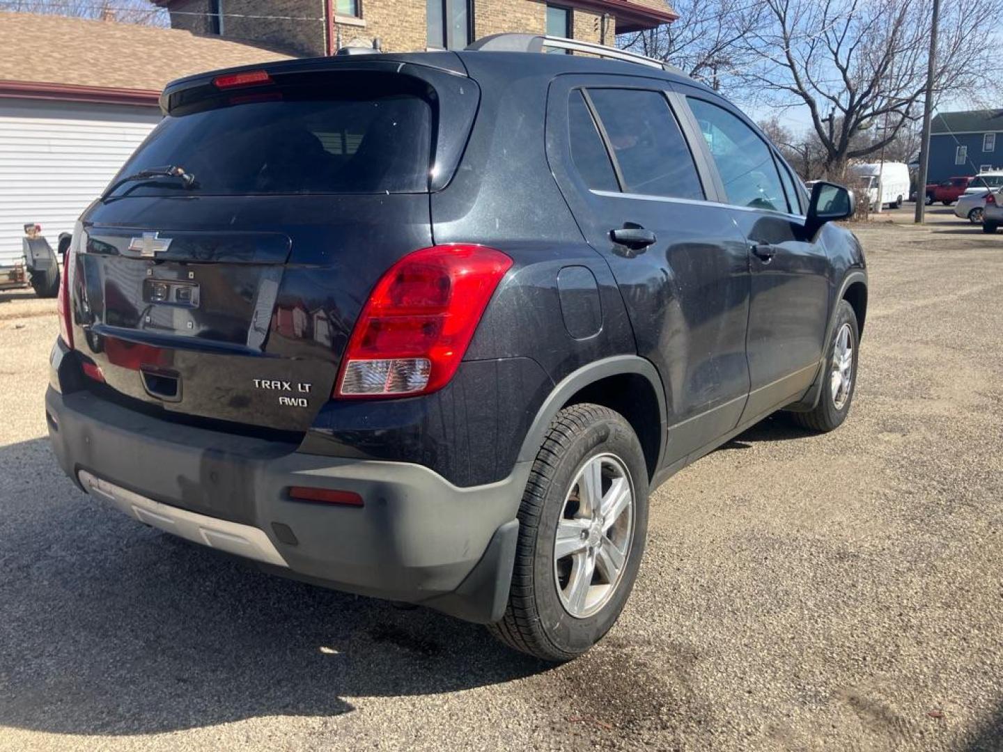 2015 BLACK CHEVROLET TRAX 1LT (3GNCJRSB5FL) with an 1.4L engine, Automatic transmission, located at 1708 Broadway, Rockford, IL, 61104, (815) 397-5010, 42.252522, -89.069359 - Photo#2