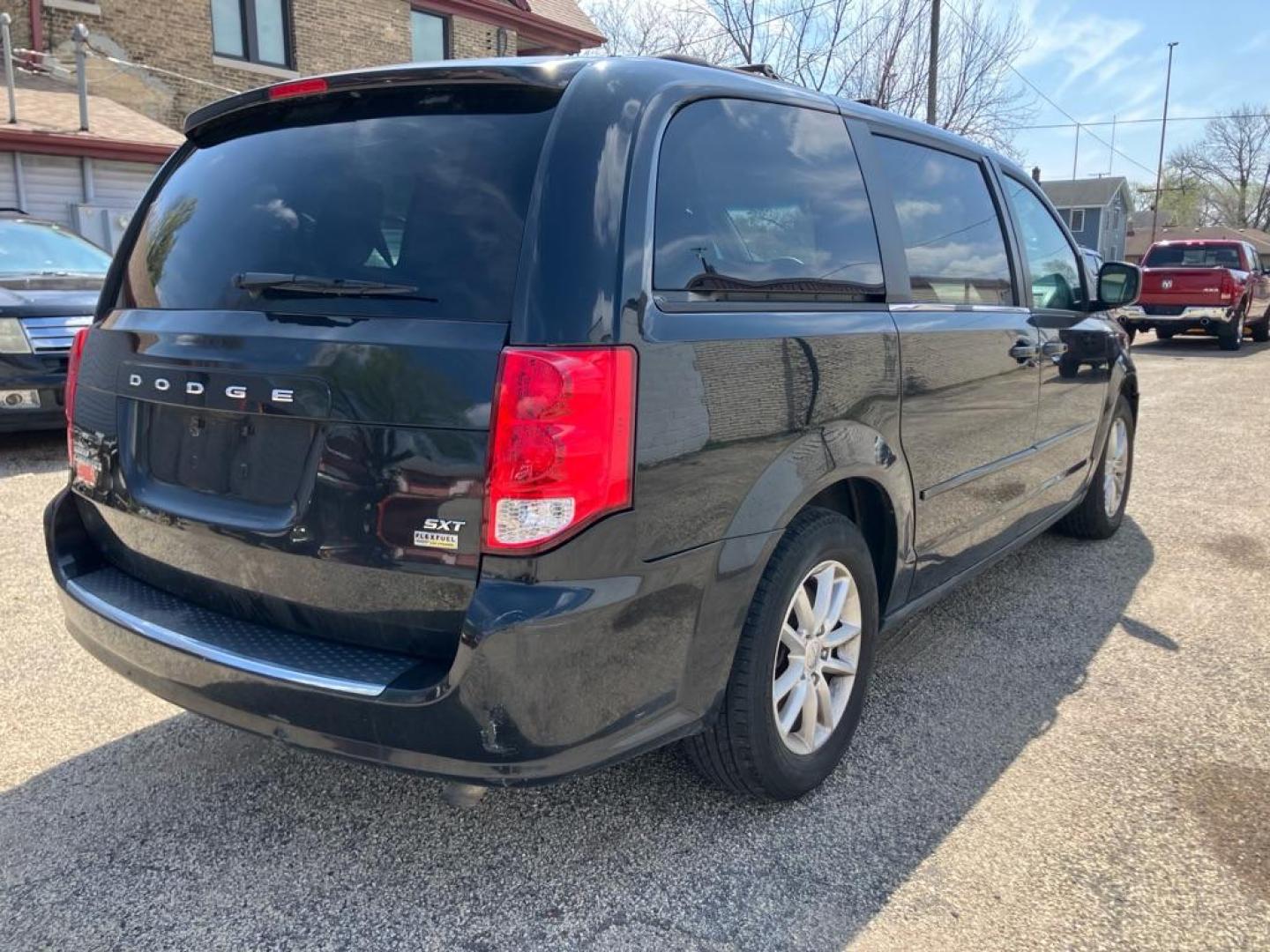 2014 BLACK DODGE GRAND CARAVAN SXT (2C4RDGCG4ER) with an 3.6L engine, Automatic transmission, located at 1708 Broadway, Rockford, IL, 61104, (815) 397-5010, 42.252522, -89.069359 - Photo#2