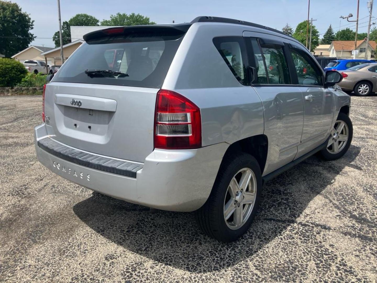 2010 SILVER JEEP COMPASS SPORT (1J4NF4FB3AD) with an 2.4L engine, Continuously Variable transmission, located at 1708 Broadway, Rockford, IL, 61104, (815) 397-5010, 42.252522, -89.069359 - Photo#2