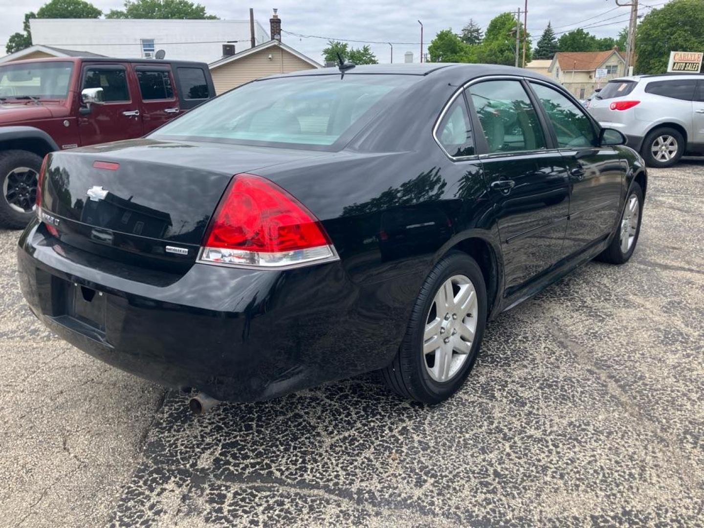 2014 BLACK CHEVROLET IMPALA LIMITED LT (2G1WB5E33E1) with an 3.6L engine, Automatic transmission, located at 1708 Broadway, Rockford, IL, 61104, (815) 397-5010, 42.252522, -89.069359 - Photo#2