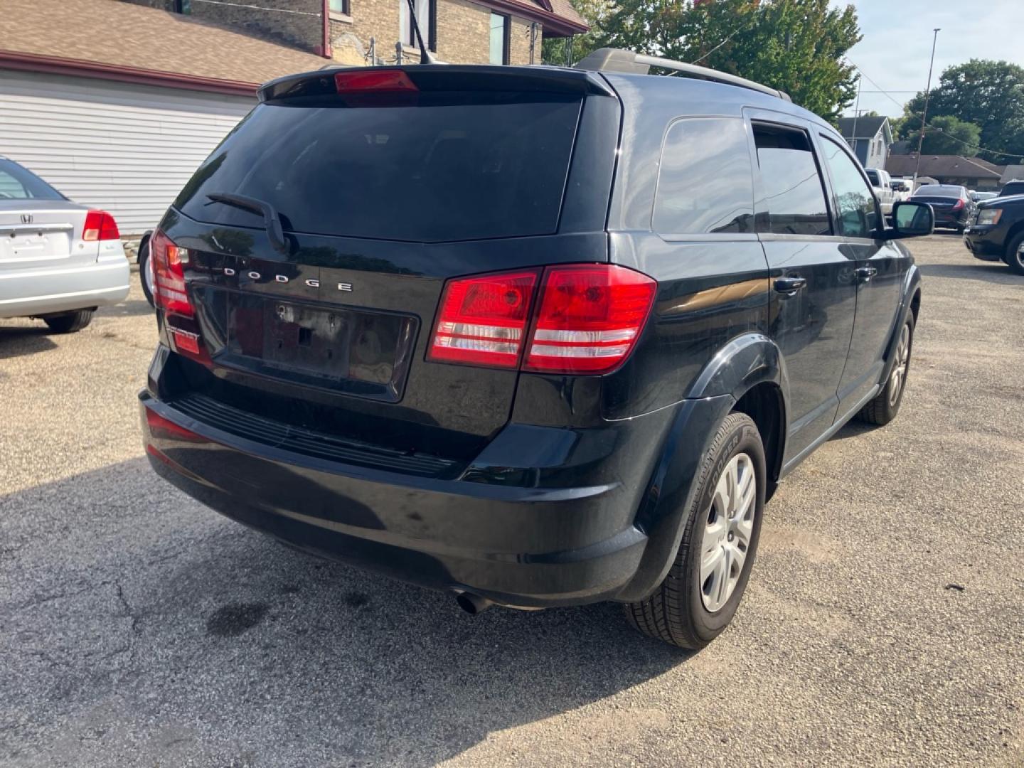 2017 BLACK DODGE JOURNEY SE (3C4PDCAB5HT) with an 2.4L engine, Automatic transmission, located at 1708 Broadway, Rockford, IL, 61104, (815) 397-5010, 42.252522, -89.069359- Photo#2