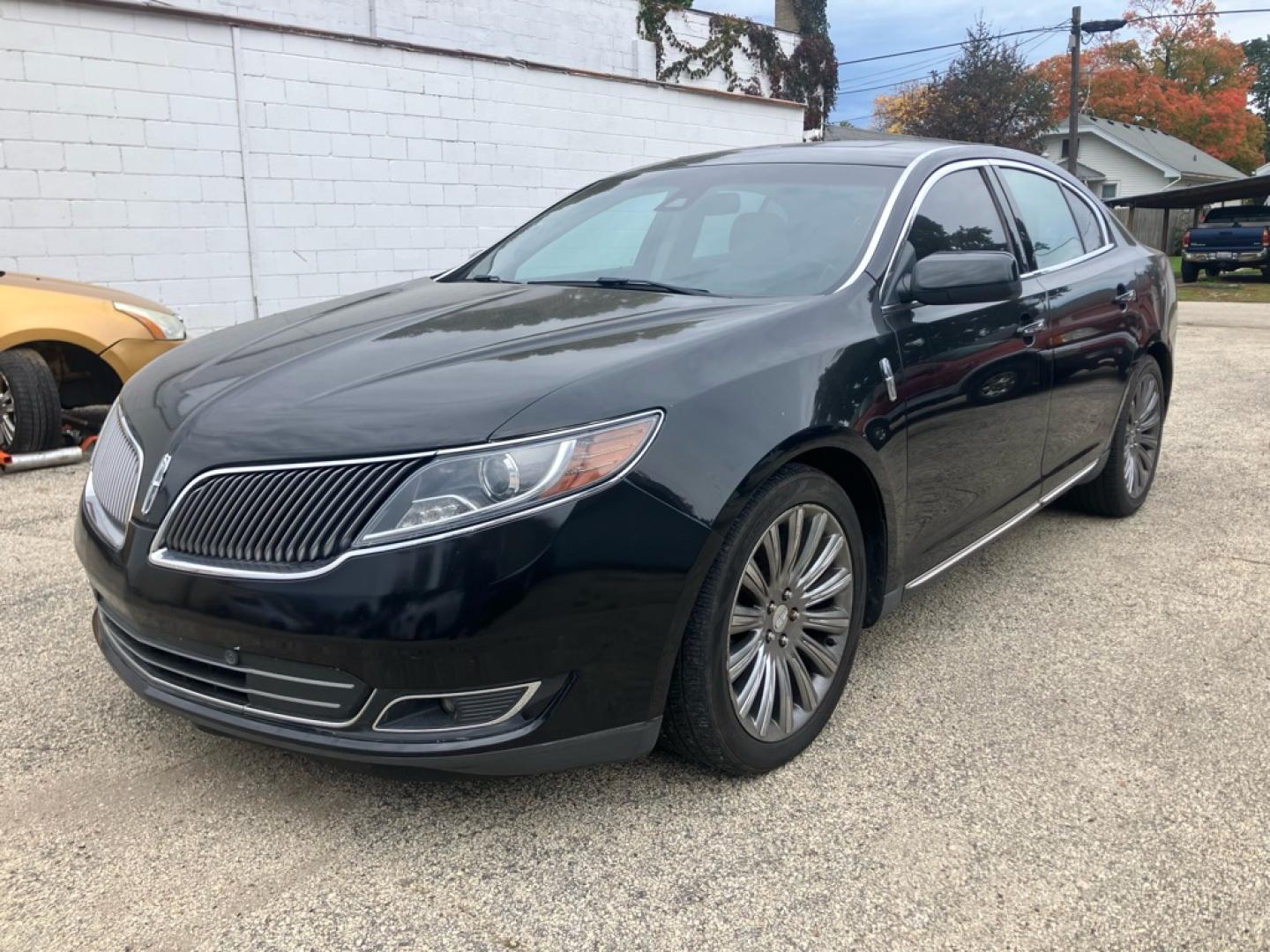 2015 BLACK LINCOLN MKS (1LNHL9EK8FG) with an 3.7L engine, Automatic transmission, located at 1708 Broadway, Rockford, IL, 61104, (815) 397-5010, 42.252522, -89.069359- Photo#1