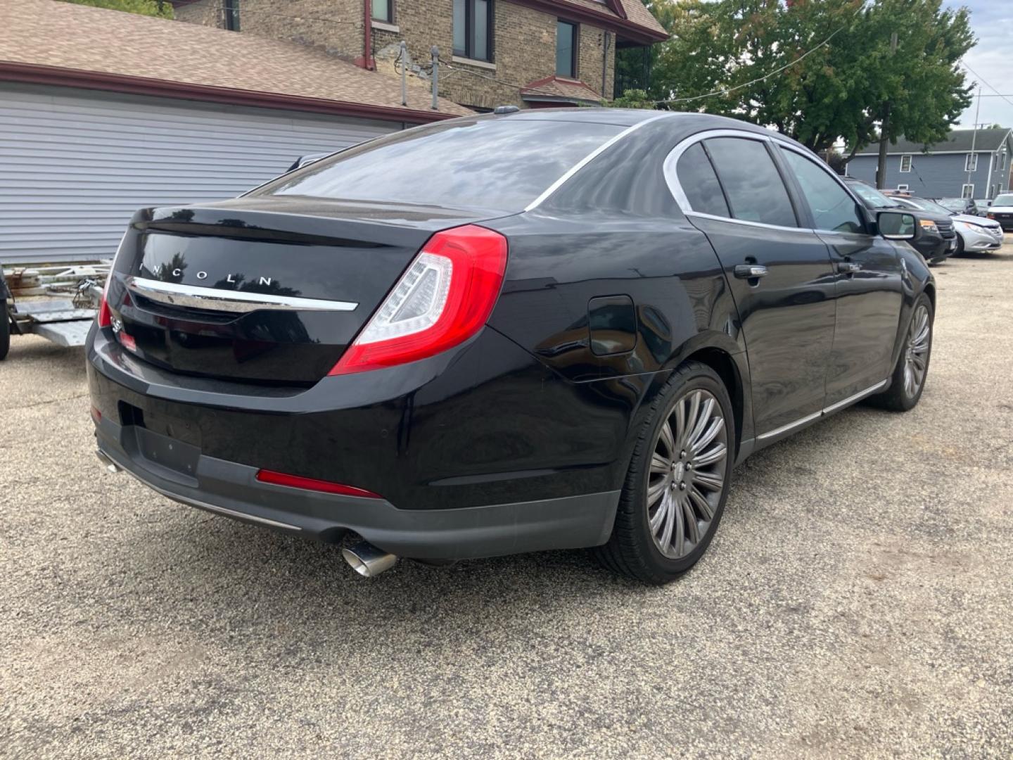 2015 BLACK LINCOLN MKS (1LNHL9EK8FG) with an 3.7L engine, Automatic transmission, located at 1708 Broadway, Rockford, IL, 61104, (815) 397-5010, 42.252522, -89.069359- Photo#2