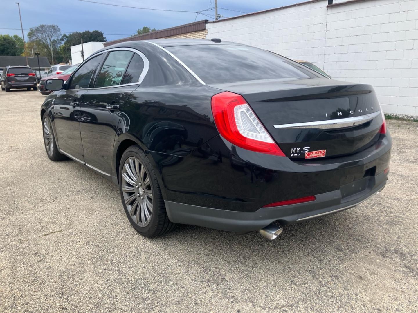 2015 BLACK LINCOLN MKS (1LNHL9EK8FG) with an 3.7L engine, Automatic transmission, located at 1708 Broadway, Rockford, IL, 61104, (815) 397-5010, 42.252522, -89.069359- Photo#3